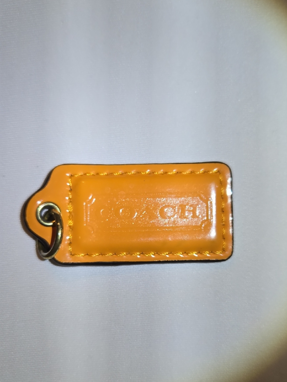 Coach Tangerine Leather Hangtag with Gold Ring